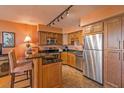 Stylish kitchen with stainless steel appliances, granite countertops, and wooden cabinets at 330 Concord St # 8E, Charleston, SC 29401
