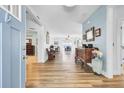 Inviting foyer featuring beautiful wood floors and views into the living and dining areas at 3473 Plow Ground Rd, Johns Island, SC 29455