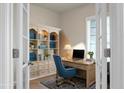 Cozy home office with built-in bookcase, desk, and large window for ample natural light at 505 Eastern Isle Ave, Summerville, SC 29486