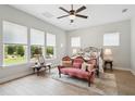 Serene bedroom with natural light, vintage furniture, and hardwood floors creating a relaxing atmosphere at 516 Tidewater Chase Ln, Summerville, SC 29486