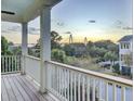 Picturesque balcony view showcasing a stunning bridge against a vibrant sunset backdrop at 828 Bridge Point Cir, Mount Pleasant, SC 29464