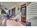 Charming front porch with comfortable seating, a ceiling fan, and an inviting front door at 828 Bridge Point Cir, Mount Pleasant, SC 29464