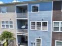 Exterior multi-story balcony features white railings with views to other buildings and landscaping at 9206 Southern Oak Lane Ln, Ladson, SC 29456