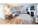 Spacious living area with fireplace, neutral tones, and comfortable seating at 9229 N Moreto Cir, Summerville, SC 29485