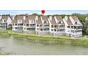 Waterfront property with multiple levels of decks and outdoor seating, providing ample space for relaxation and entertainment at 250 Little Oak Island Dr, Folly Beach, SC 29439