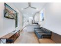 Bright, open living area featuring white walls and plenty of natural light, with hardwood floors and modern furnishings at 29 Hanover St, Charleston, SC 29403