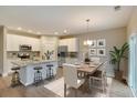 Eat-in kitchen and dining room showcasing granite countertops and stainless steel appliances at 3006 Abagail Ct, North Charleston, SC 29406