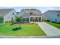 Beautiful single-story home featuring a lush lawn and charming front porch at 366 Tupelo Lake Dr, Summerville, SC 29486