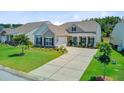 Attractive single-story home featuring a well-kept lawn and cozy front porch at 366 Tupelo Lake Dr, Summerville, SC 29486