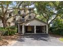 Exterior of a two-story home with a driveway and covered parking for two golf carts at 410 Yacht Harbor Ct # 410, Isle of Palms, SC 29451