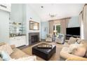 Bright living room with fireplace, plush seating, and a large window at 410 Yacht Harbor Ct # 410, Isle of Palms, SC 29451