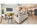 Open-concept living room flows into the kitchen, creating an inviting space for relaxation and entertaining at 422 Duskywing Dr, Goose Creek, SC 29445