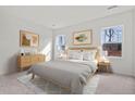 Bright bedroom with neutral decor, large windows offering natural light, and hardwood floors at 528 Pender Woods Dr, Summerville, SC 29486