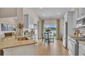 Bright kitchen with stainless steel appliances, granite countertops, and access to a patio at 544 Verdi Drive Dr, Summerville, SC 29486