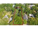 An aerial view shows the property lines and lush green tree coverage surrounding the residence at 624 Atlantic St, Mount Pleasant, SC 29464
