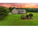 Inviting single-Gathering home with front porch and mature landscaping at 727 Sonny Boy Ln, Johns Island, SC 29455