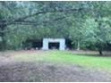 View of garage surrounded by lots of trees at 838 Ranch Hill Ln, Saint Stephen, SC 29479