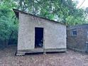 Exterior view of wooden shed and brick home at 838 Ranch Hill Ln, Saint Stephen, SC 29479