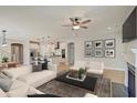 Bright living area with hardwood floors and a fireplace seamlessly connects to the open-concept kitchen and dining space at 8629 Connor Ct, North Charleston, SC 29406