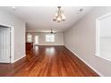 Spacious living area with stylish wood floors, complemented by natural light and open concept design at 107 Brookhaven Rd, Summerville, SC 29486