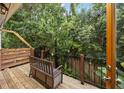 Charming deck area with a bench and view of the surrounding lush greenery at 11 America St, Charleston, SC 29403