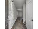Inviting hallway showcasing hardwood flooring and decorative curtains at 110 Cardinal Flower Ct, Moncks Corner, SC 29461