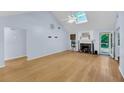 Bright living room with hardwood floors, fireplace and vaulted ceiling with a skylight at 1309 Llewellyn Rd, Mount Pleasant, SC 29464