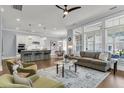 Open-concept living room with hardwood floors and ample natural light at 1392 Founders Way, Mount Pleasant, SC 29464