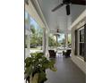 Inviting front porch with rocking chairs and ceiling fans, perfect for relaxing at 205 Delahow St, Daniel Island, SC 29492