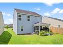 A view of the backyard and screened in porch at 251 Coosawatchie St, Summerville, SC 29485