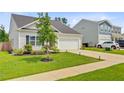 Beautiful one-story home featuring a well-kept lawn and a two car garage at 266 Torslanda Ln, Summerville, SC 29486