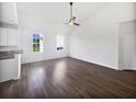 Spacious living room with hardwood floors, recessed lighting, and large windows showcasing natural light at 2910 John Cabot Dr, North Charleston, SC 29420