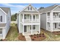 Charming two-story home featuring a welcoming front porch and second story balcony at 314 O'Malley Dr, Summerville, SC 29483