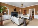 Cozy living room showcasing a fireplace, built-in shelving, and comfortable seating at 55 E Bay St, Charleston, SC 29401