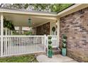 Inviting front porch with white railing and beautifully potted plants at 10 Teaneck Rd, Goose Creek, SC 29445
