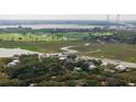 Scenic aerial view of Charleston with the Ravenel Bridge and waterfront homes surrounded by marshland at 108 Live Oak Dr, Mount Pleasant, SC 29464