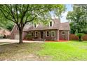 Charming brick home with a well-manicured lawn, mature trees, and inviting curb appeal at 129 Dunbury Dr, Summerville, SC 29485