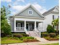Inviting two-story home with a classic front porch and meticulous landscaping at 1517 Willtown St, Charleston, SC 29492