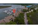 Aerial view of a condo complex with a marina, showcasing its waterfront location and proximity to boats at 1919 Marsh Oak Ln, Seabrook Island, SC 29455