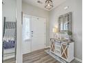 Warm and inviting foyer with decorative accents, stylish floors, and ample natural light at 207 Center Hill Ct, Summerville, SC 29485