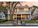Charming two-story home featuring a double-door entry and a well-manicured front yard at 2142 Golfview Dr, Charleston, SC 29412