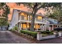 Charming two-story home featuring dual balconies with manicured landscaping and side driveway at 2142 Golfview Dr, Charleston, SC 29412