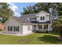 A well-maintained home with a tidy lawn and traditional design elements at 237 Dillard Dr, Goose Creek, SC 29445