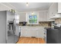Bright kitchen with stainless steel appliances, ample counter space, and a window over the sink at 2631 Ridgewood Ave, Charleston, SC 29414