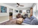 Comfortable living room with a ceiling fan, rug, and access to the kitchen, ideal for entertaining at 2631 Ridgewood Ave, Charleston, SC 29414
