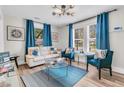 Bright living room with contemporary furnishings, hardwood floors, and bright, natural light at 2666 Poplin Ave, North Charleston, SC 29405