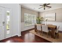 An inviting dining area features a stylish wooden table, seating for six, and dark hardwood flooring at 3807 Canary Ct, North Charleston, SC 29420