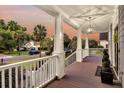 Relaxing front porch featuring wood floors, white railings, and neighborhood views at 401 Felders Ln, Johns Island, SC 29455
