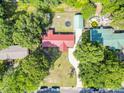 An aerial view of a home surrounded by mature trees, a large backyard, and long driveway at 617 Deepwood Ct, Moncks Corner, SC 29461