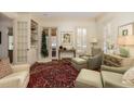 Inviting living room with fireplace and French doors, blending comfort and style at 74 Hospitality St, Mount Pleasant, SC 29464